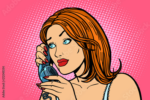 attentive Woman talking on the phone. Emotions.