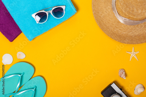 Summer composition of beach accessories and seashells top view