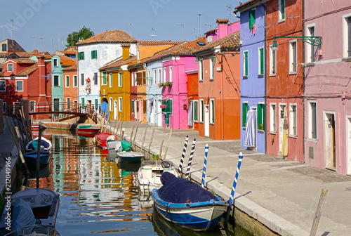 Fototapeta Naklejka Na Ścianę i Meble -  Serene empty streets of Burano, Venice on a sunny day in the tourist low season.