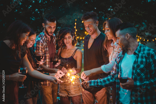 Group of friends spending time making a picnic and a barbeque