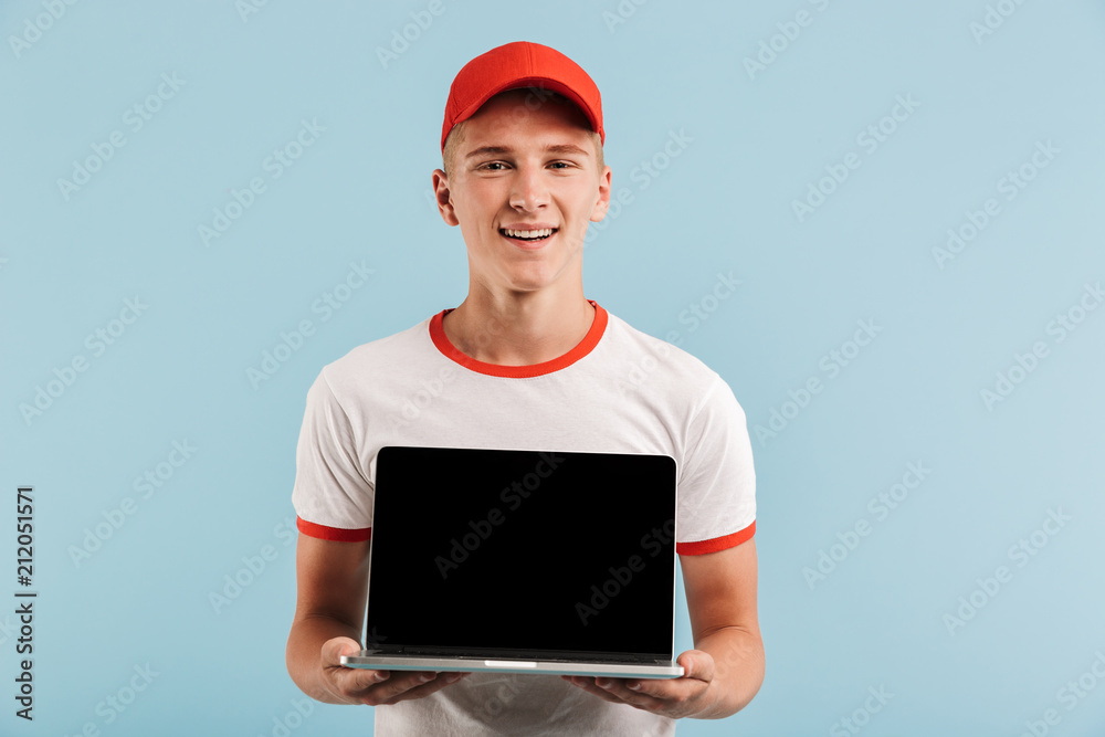 Portrait of a smiling casual teenage boy in red cap Portrait of a smiling casual teenage boy in red cap