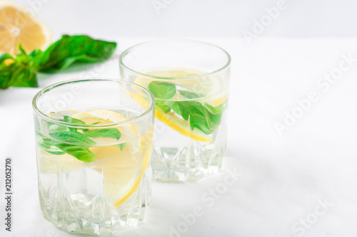 Basil lemon water. Drink infused water cocktail. Healthy lifestyle concept. Copy space