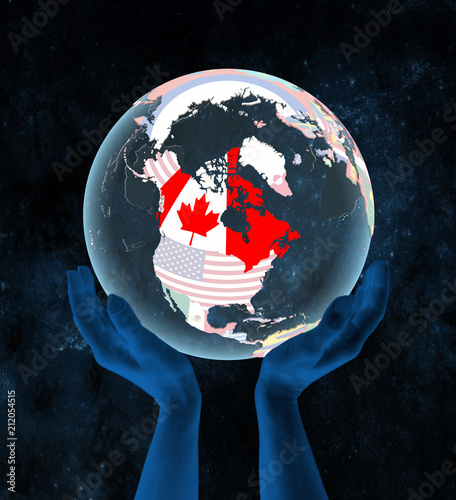 Canada on political globe in hands