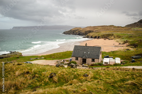 House on the beach in front of the ocean. Scottish landscape. Scotland, Great Britain