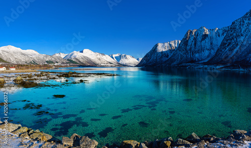 Panoramic view of beautiful winter lake with snowy mountains at Lofoten Islands in Northern Norway