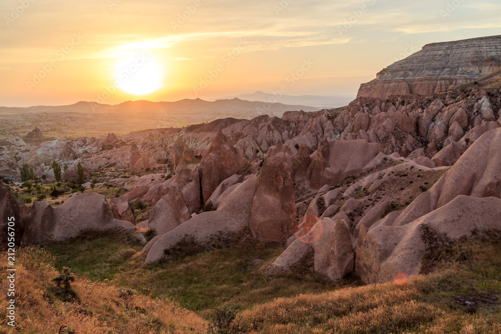 Unreal landscape of Cappadocia. Colorful sunset in valley. G reme National Park of Turkey, background