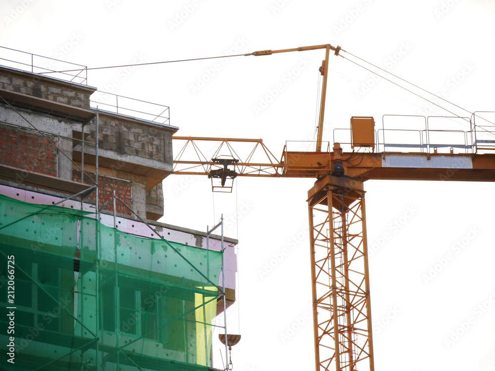 Crane near building under construction.