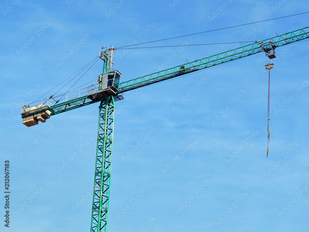 Construction crane against blue sky.