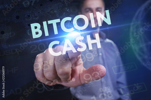 The concept of business, technology, the Internet and the network. A young entrepreneur working on a virtual screen of the future and sees the inscription: bitcoin cash