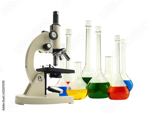 Laboratory metal microscope and test tubes with liquid isolated on white