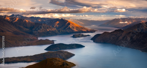 Sunrise landscape panoramic view of lake and mountains from Roy's peak, New Zealand photo