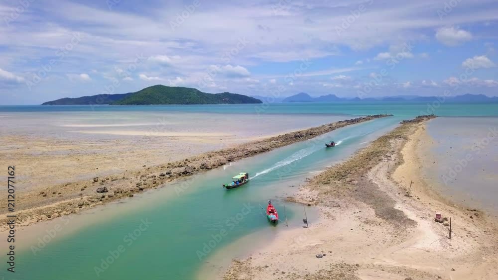Aerial View of Thai Traditional Longtail Boat Sailing Through Waterway Channel Made in Sand Beach Aerial View of Thai Traditional Longtail Boat Sailing Through Waterway Channel Made in Sand Beach