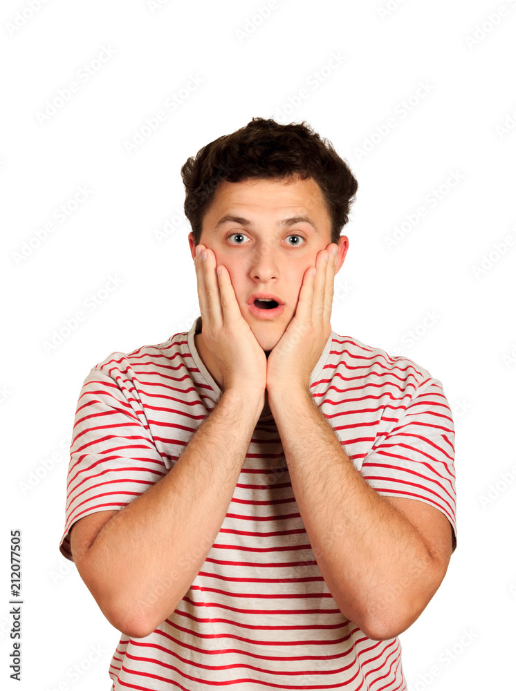 man does not believe his success, keeps hands on head, stares at camera, says omg or wow. emotional guy isolated on white background man does not believe his success, keeps hands on head, stares at camera, says omg or wow. emotional guy isolated on white background
