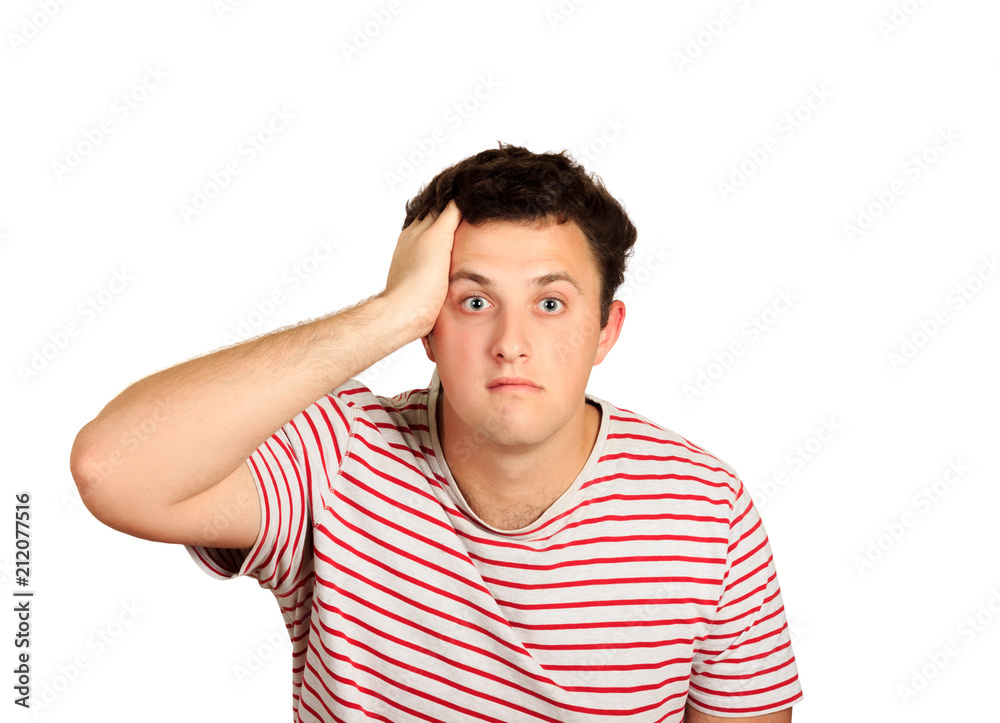 Studio shot of young man looking shocked with hand on head. emotional guy isolated on white background Studio shot of young man looking shocked with hand on head. emotional guy isolated on white background