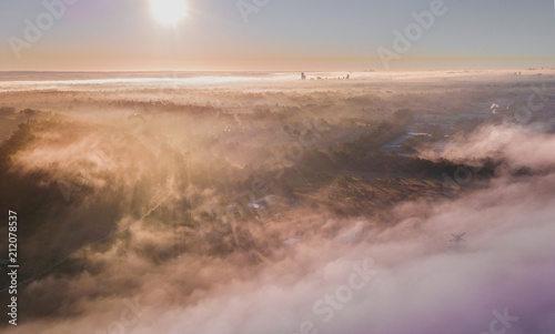 Photography Fog and mist with the rays of sun shining through in the morning