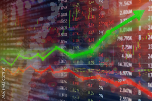 Investing and stock market concept gain and profits with faded candlestick charts.