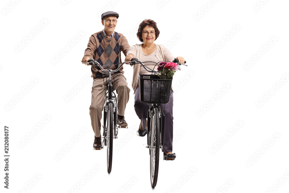 Obraz premium Elderly man and an elderly woman riding bicycles towards the camera