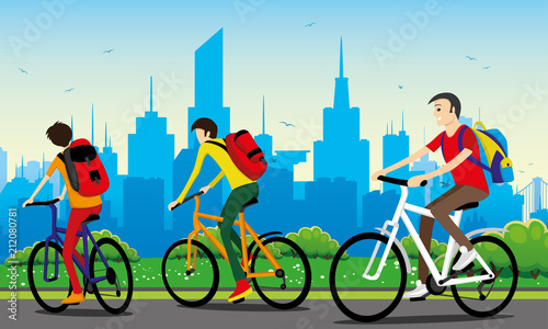 Cyclists with backpacks ride in the city park.