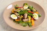 Fish salad with quail eggs, sweet peppers and fresh herbs
