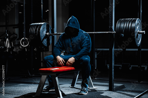 Strong man working in gym