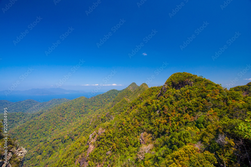 Beautiful panoramic view of Langkawi Island's sea and mountains which can be admired from the Langkawi Sky Bridge deck on the peak of Gunung Mat Chinchang, Malaysia. Beautiful panoramic view of Langkawi Island's sea and mountains which can be admired from the Langkawi Sky Bridge deck on the peak of Gunung Mat Chinchang, Malaysia.