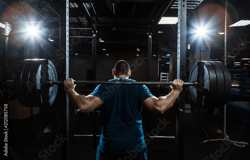 Fotografie Strong man working in gym