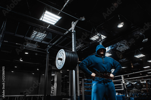 Strong man working in gym photo