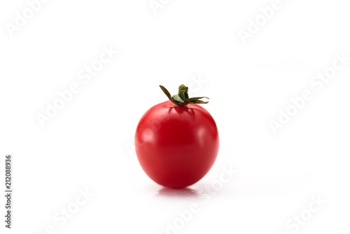 close up view of ripe cherry tomato isolated on white