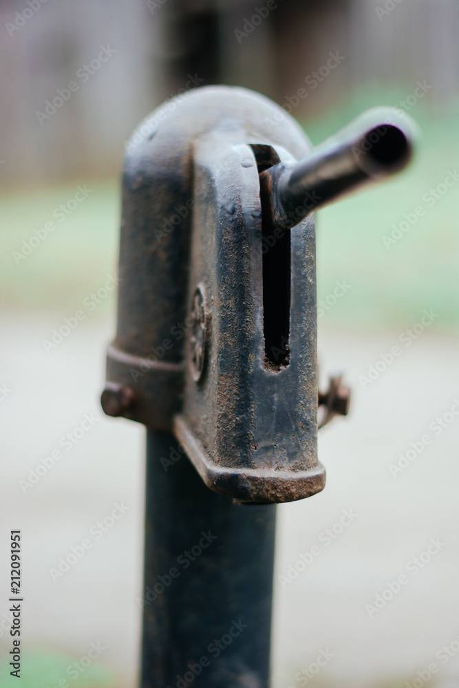 Iron column for water. Rusted iron. Column background in natural environment