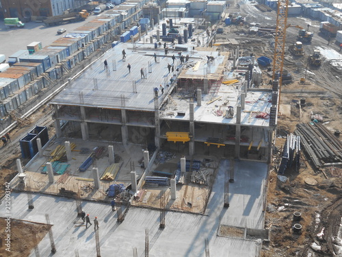 Workers at the construction site, building high-rise buildings.