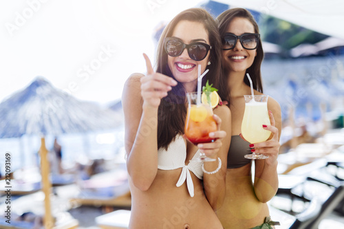 Sticker Girls drinking cocktails on beach