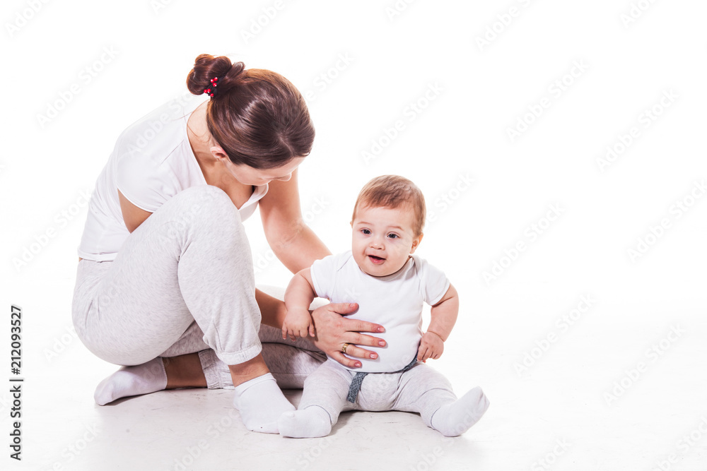 Close up view of attractive young mother with her baby Close up view of attractive young mother with her baby