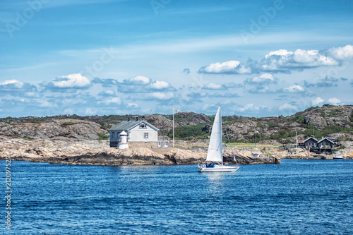 Canvas Print Picture of sea overview with boat on the water and house