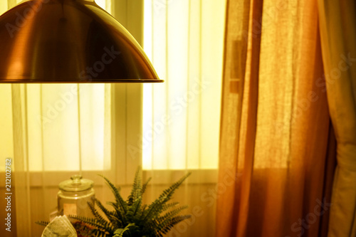 The green fabric lampshade at the magazine. colorful, decorative, electrical, furniture, illumination, lamp, lampshade, style, textile, abstract background, hanging lamp, interior design photo