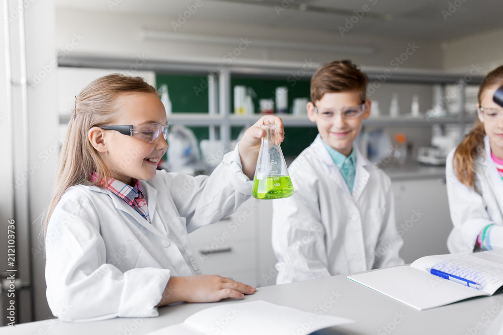 education, science and children concept - kids with test tubes studying chemistry at school laboratory education, science and children concept - kids with test tubes studying chemistry at school laboratory