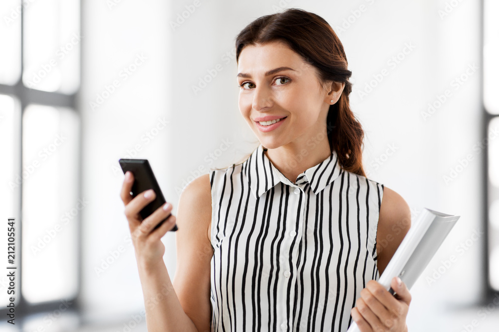 business people, technology and corporate concept - businesswoman or realtor with smartphone and folder at office