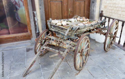 Old wooden cart is at the porch photo