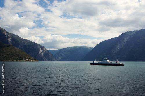 Ferry ship crosses the sea in the fjord in Norway © morelena
