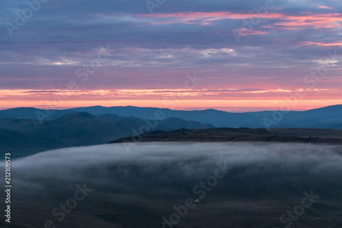 Fog in the Tazheran steppes in the evening  at sunset