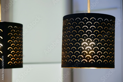 The green fabric lampshade at the magazine. colorful, decorative, electrical, furniture, illumination, lamp, lampshade, style, textile, abstract background, hanging lamp, interior design photo