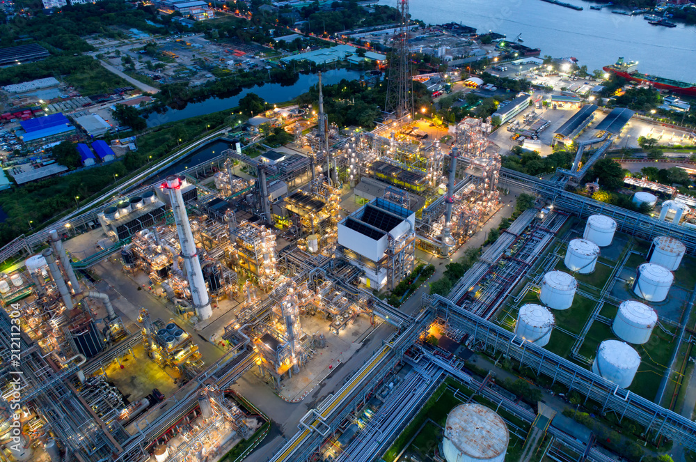 Fototapeta premium Aerial view of twilight of oil refinery ,Shot from drone of Oil refinery and Petrochemical plant at dusk , Bangkok, Thailand