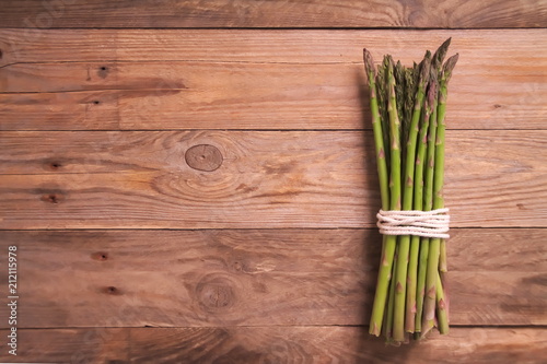 Fresh asparagus on wooden surface