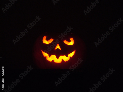 Halloween pumpkin in a dark room noise