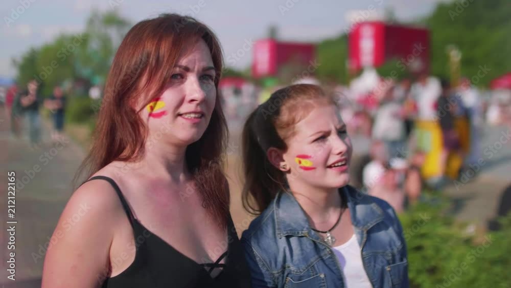 Girls worry while watching football match in fan zone Girls worry while watching football match in fan zone