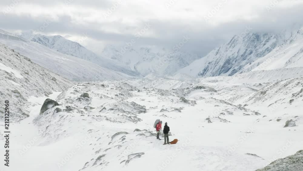 Backpackers on Larke Pass in Nepal, 5100m altitude. Manaslu circuit trek area. Backpackers on Larke Pass in Nepal, 5100m altitude. Manaslu circuit trek area.