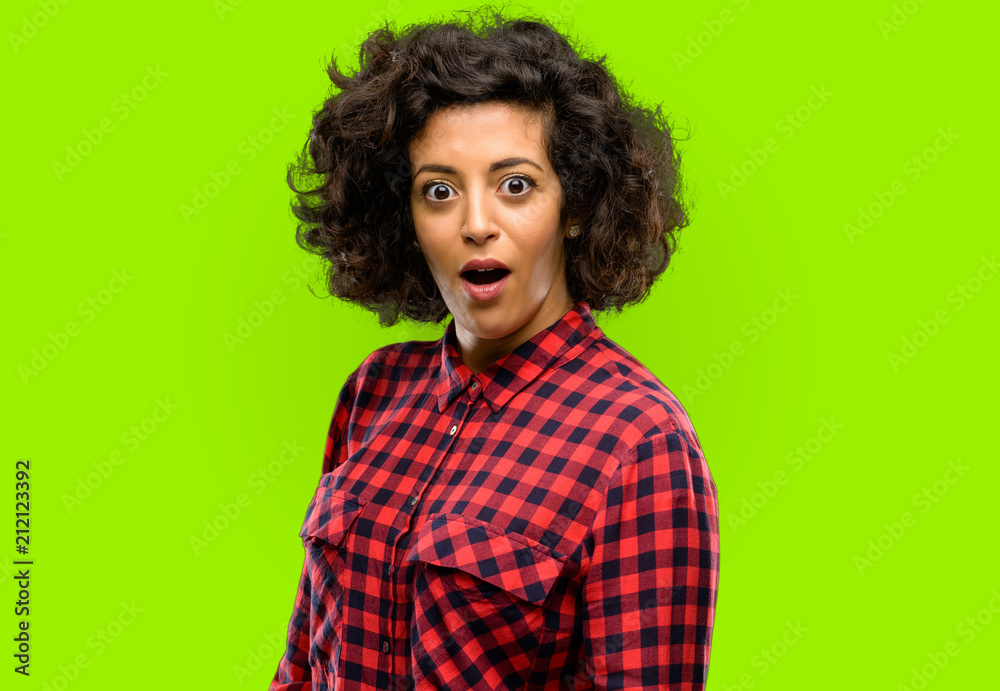 Beautiful arab woman scared and surprised cheering expressing wow gesture. Unbelieving Beautiful arab woman scared and surprised cheering expressing wow gesture. Unbelieving