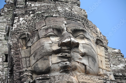 The Bayon is a well-known and richly decorated Khmer temple at Angkor in Cambodia. Built in the late 12th or early 13th century as the official state temple of the Mahayana Buddhist King Jayavarman VI photo