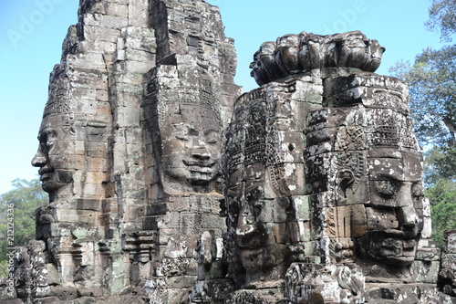 The Bayon is a well-known and richly decorated Khmer temple at Angkor in Cambodia. Built in the late 12th or early 13th century as the official state temple of the Mahayana Buddhist King Jayavarman VI © porpendero