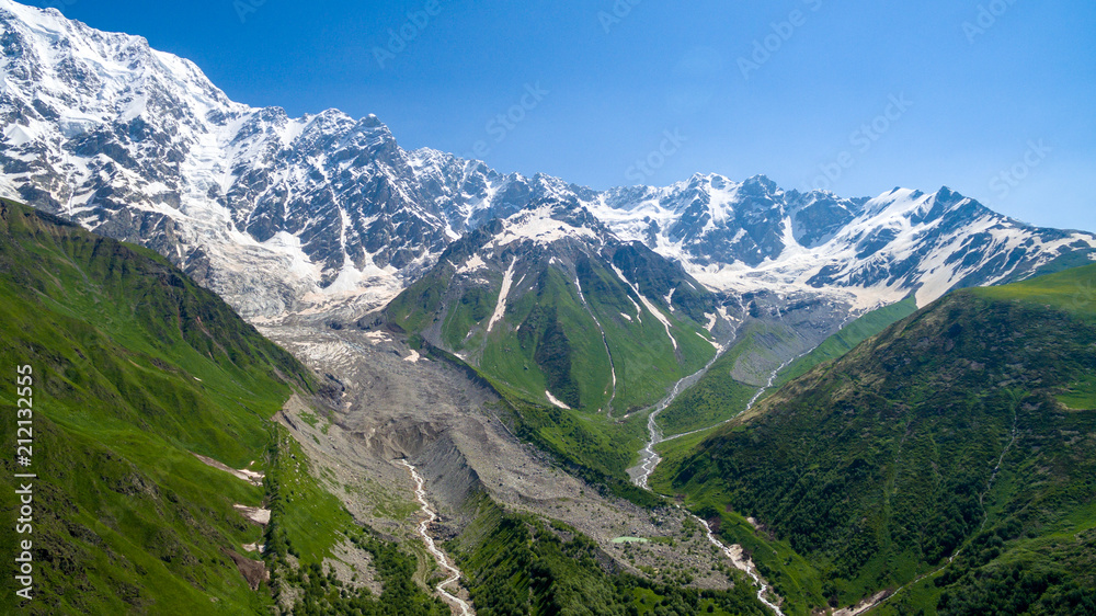 Glacier Shkhara aerial view in sunny day
