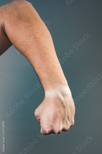 Hand showing side view of a fist
